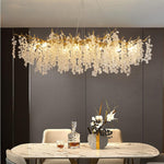 "Ethereal Vine Chandelier" installed over a dining table