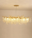 The "Ethereal Vine Chandelier" installed in a room with the lights on.