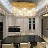 Rainfall Luxe Chandelier installed above a dining table in a kitchen.