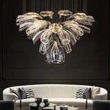 floral crystal chandelier with premium stainless steel and glass design, installed in a living room with black wall and LED lights on.