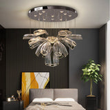 floral glass chandelier with premium stainless steel installed in a bedroom.
