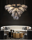 Luxurious floral crystal chandelier with glass design, installed in a living room.