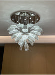 floral glass chandelier with premium stainless steel installed with lights on.