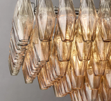 Amber Wave High-Quality Glass Chandelier with intricate, hand-blown amber glass elements and polished metal frame.